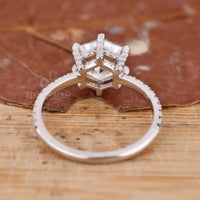 White gold ring with pavé diamonds and hexagon cut centre stone.
