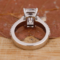 Handmade jewelry featuring emerald cut diamond engagement ring.
