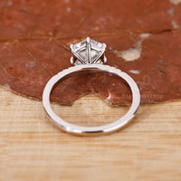 Buy Engagement ring featuring round cut side stones.
