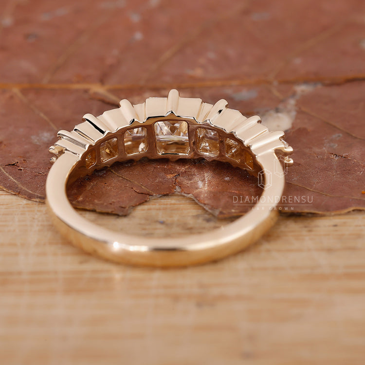 Yellow gold anniversary band for her.