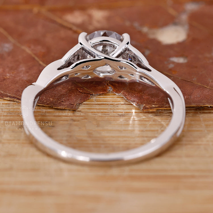 Buy engagement ring with Portuguese cut solitaire diamond and custom twist shank.

