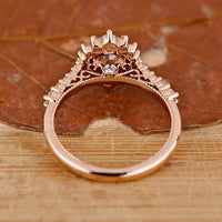 Rose gold ring with a tapered pave band.
