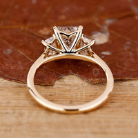 Buy Engagement ring with trapezoid side stone.
