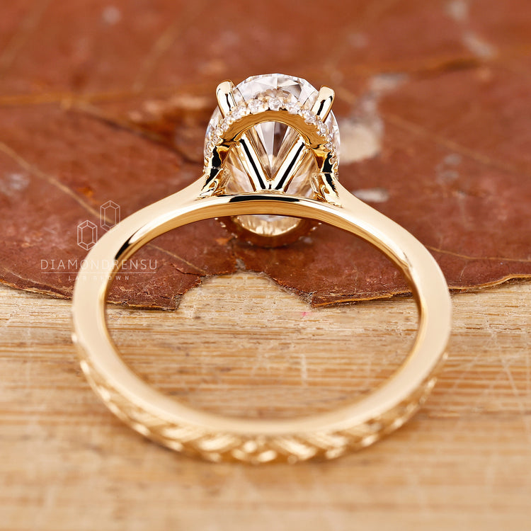 Handmade jewellery piece with custom halo and round diamond detailing.
