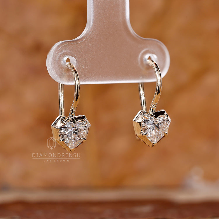 Yellow gold diamond earrings with fish hook style.
