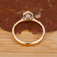 Unique hexagon cut diamond engagement ring.
