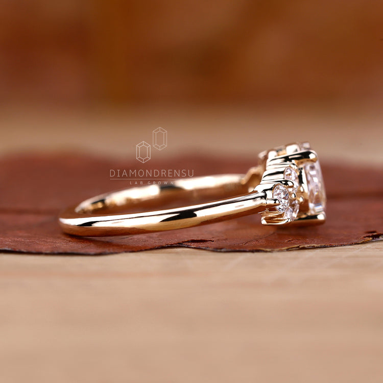 Muse setting ring paired with marquise and round side stone.
