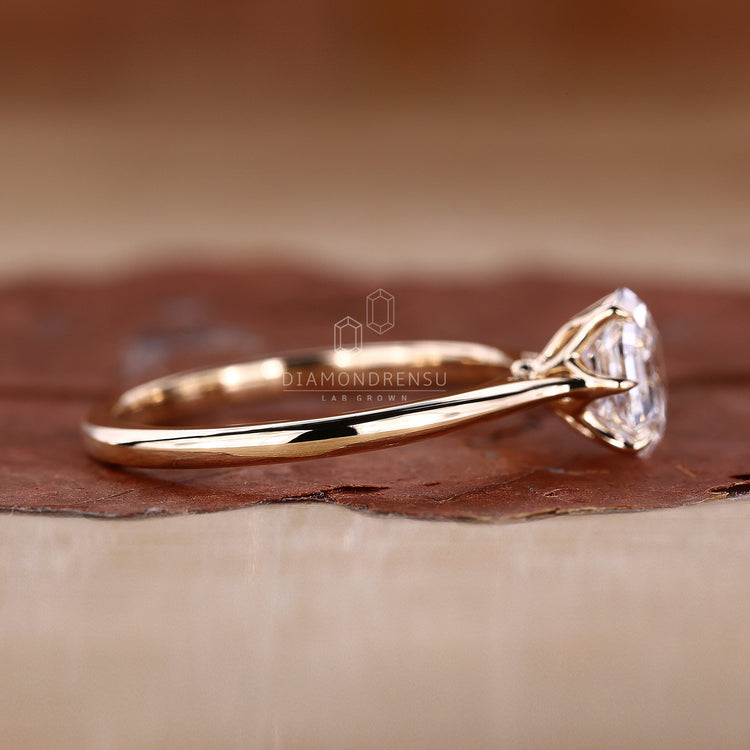 yellow gold ring with hexagon step cut diamond.
