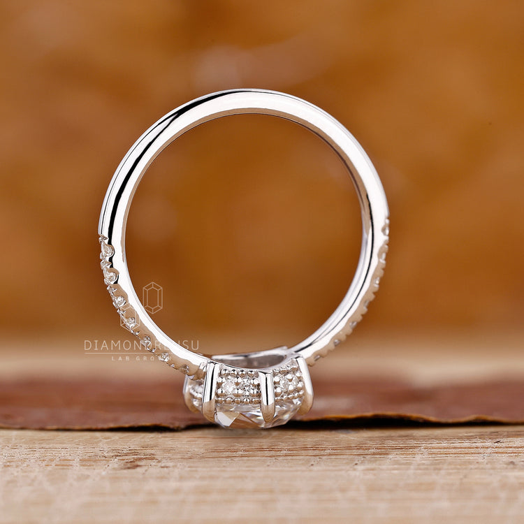 Buy engagement ring with hidden halo and round pavé diamonds.
