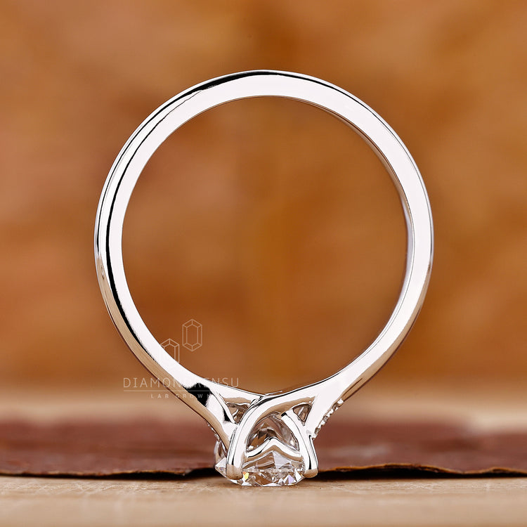 Lab grown diamond engagement ring with split shank design.

