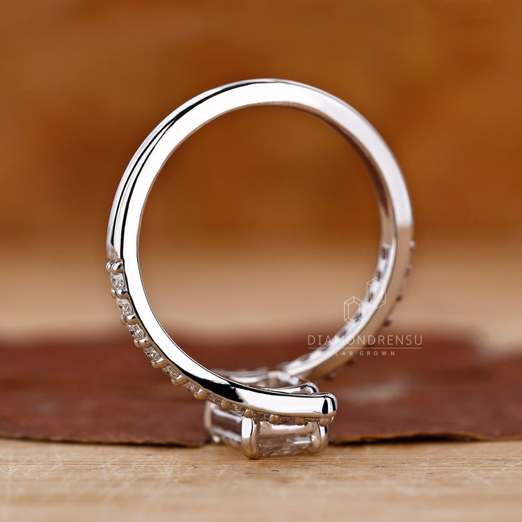 Lab grown diamond ring featuring a bypass setting and pave details.
