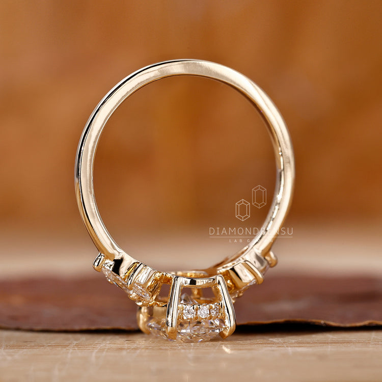 Customise ring with oval and marquise diamonds in muse setting and hidden halo design.
