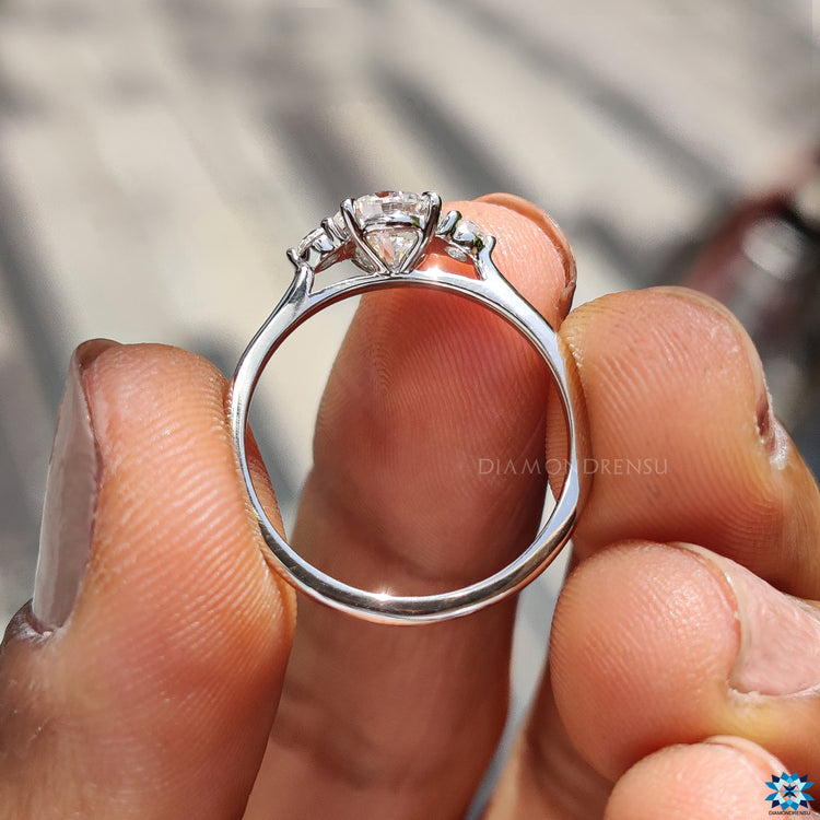 Handmade round moissanite engagement ring.