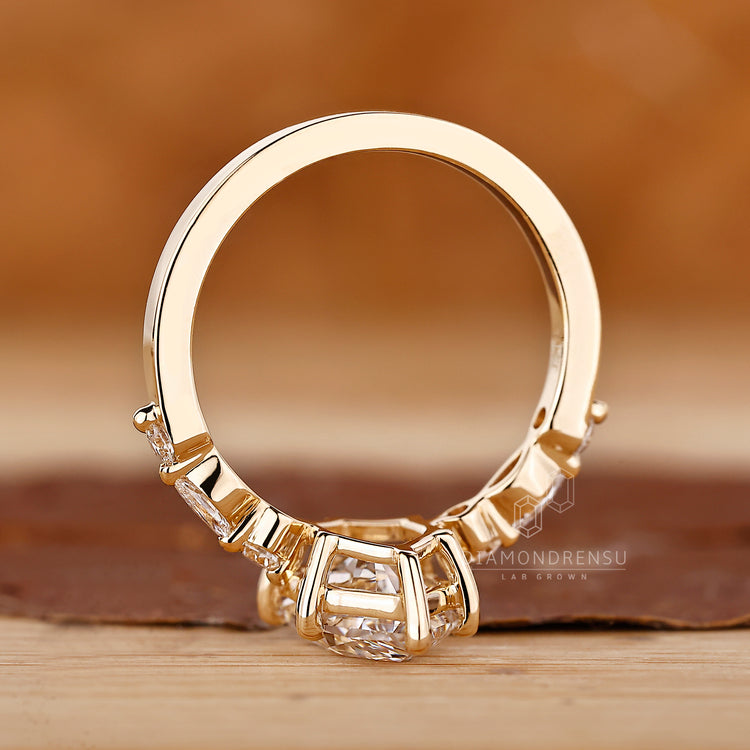 Buy Diamond Ring with Dutch marquise center in yellow gold.
