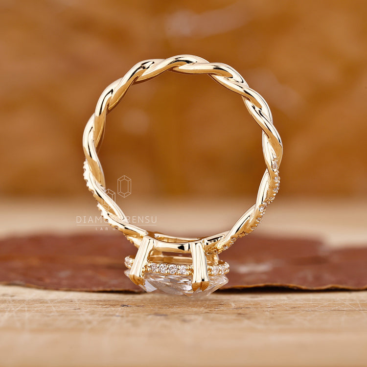 Custom diamond ring with east west orientation and pave band.
