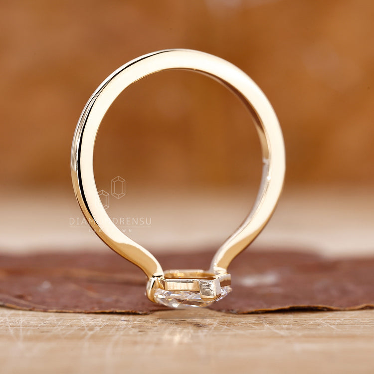 Lab grown diamond ring with v prong solitaire in yellow gold.
