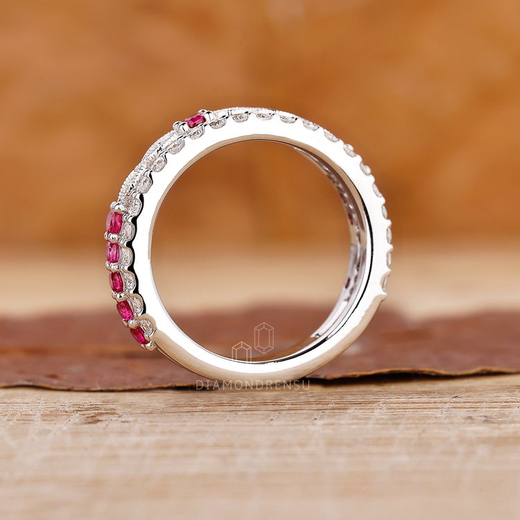 White gold stacking band with pink and ruby accents.