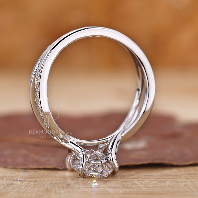Lab grown diamond marquise ring with twisted pavé in white gold.
