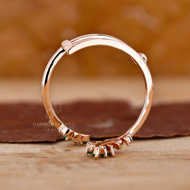 Handmade band with emerald diamond band design.