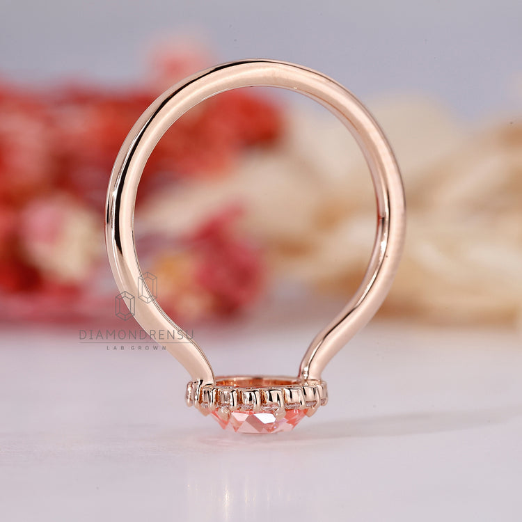 IGI certified pink diamond engagement ring in halo setting.
