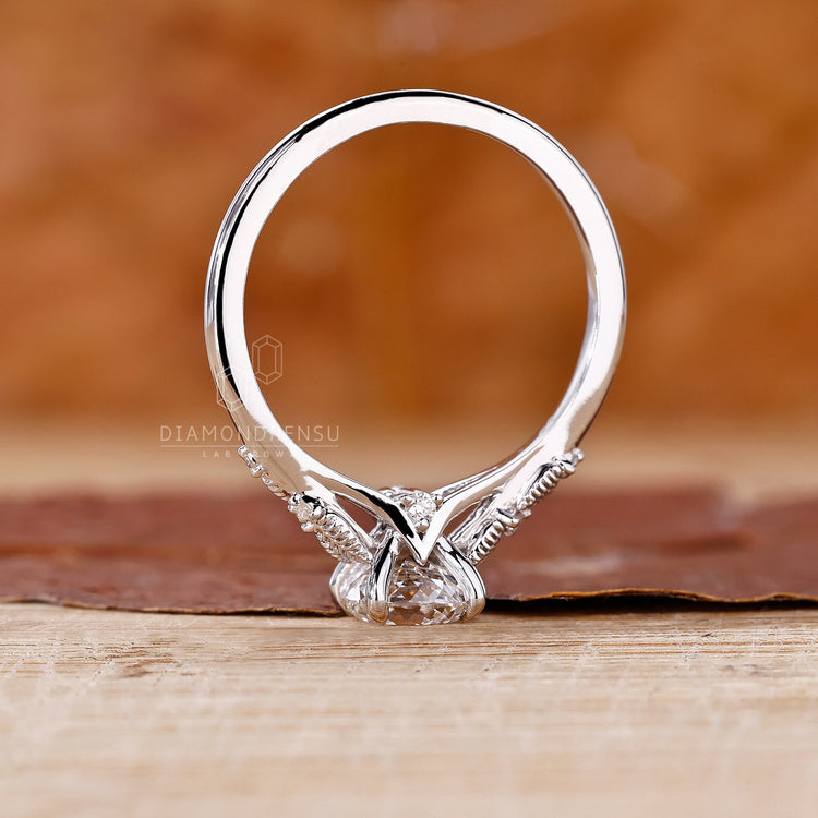 Lab grown diamond ring with Portuguese cut centre in claw prong.
