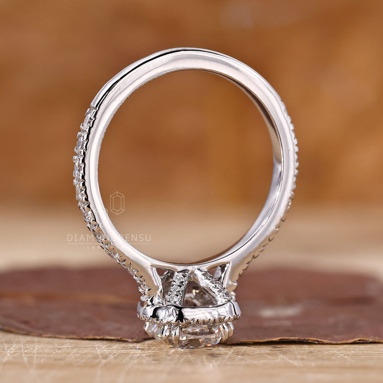 Buy engagement ring with pavé setting and cushion diamond centre.
