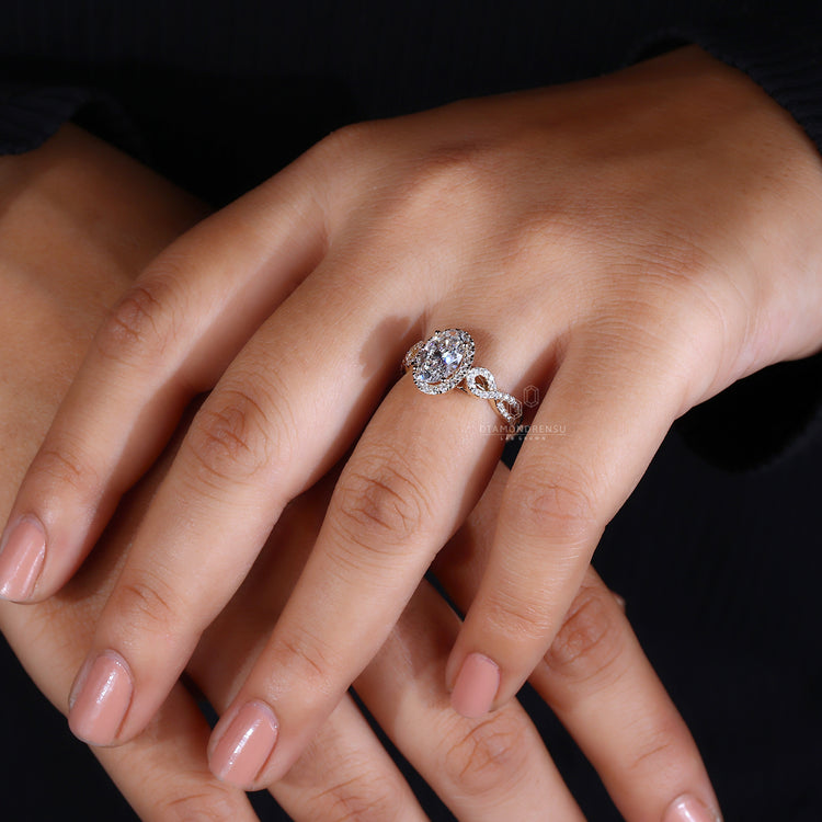 Yellow gold ring with round diamond halo and prong setting.
