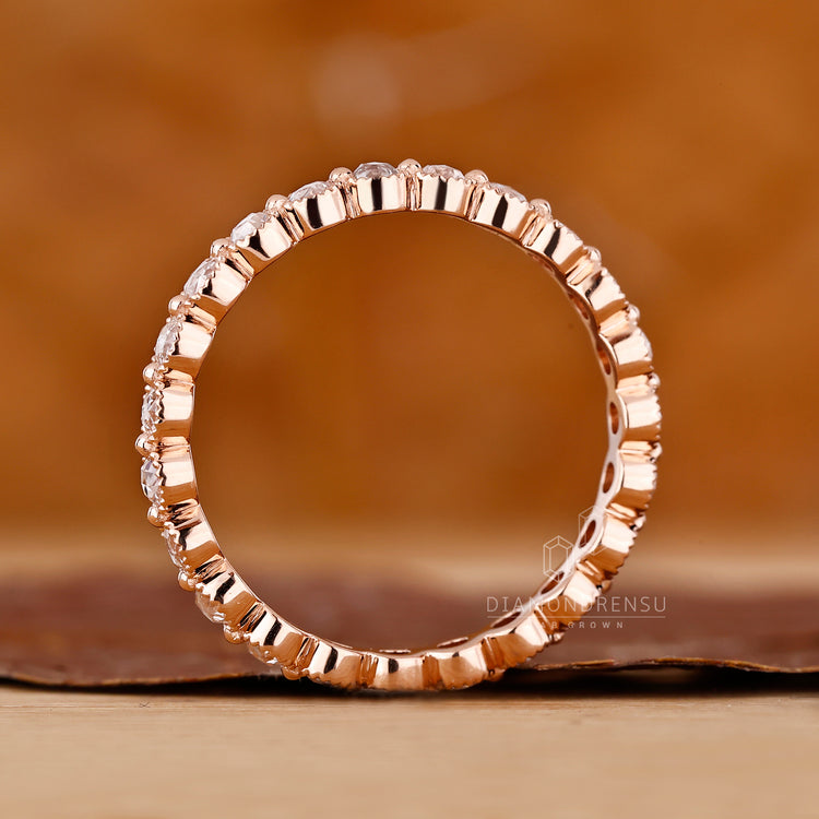 Handmade Band with milgrain edges and shared prong diamonds.
