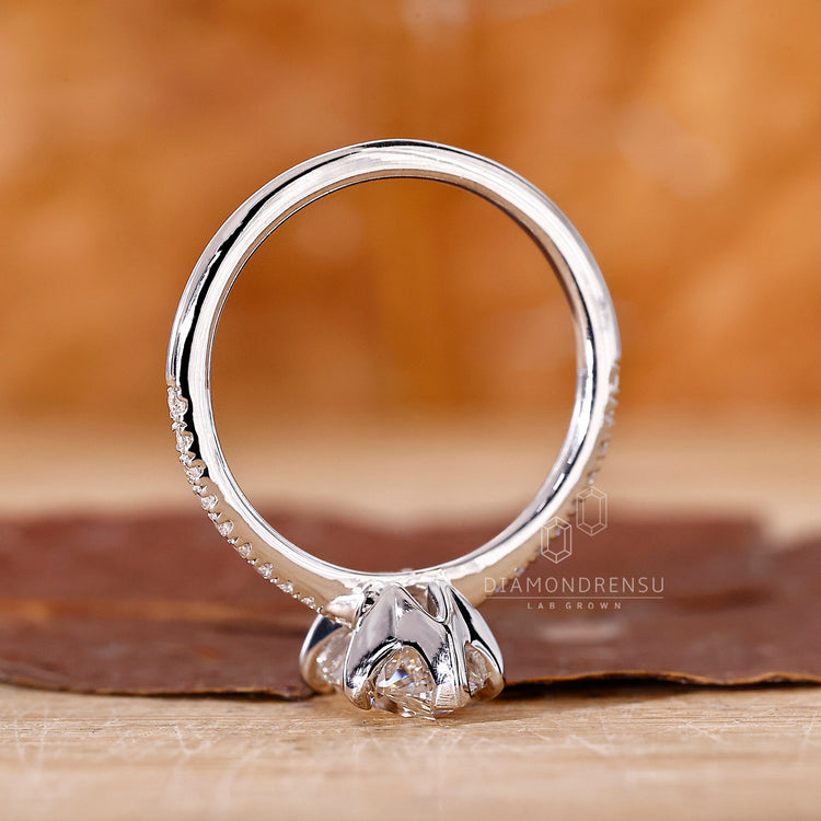 But engagement ring with claw prong setting and marquise centre stone.
