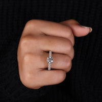 Milgrain engagement ring with round diamond centre.
