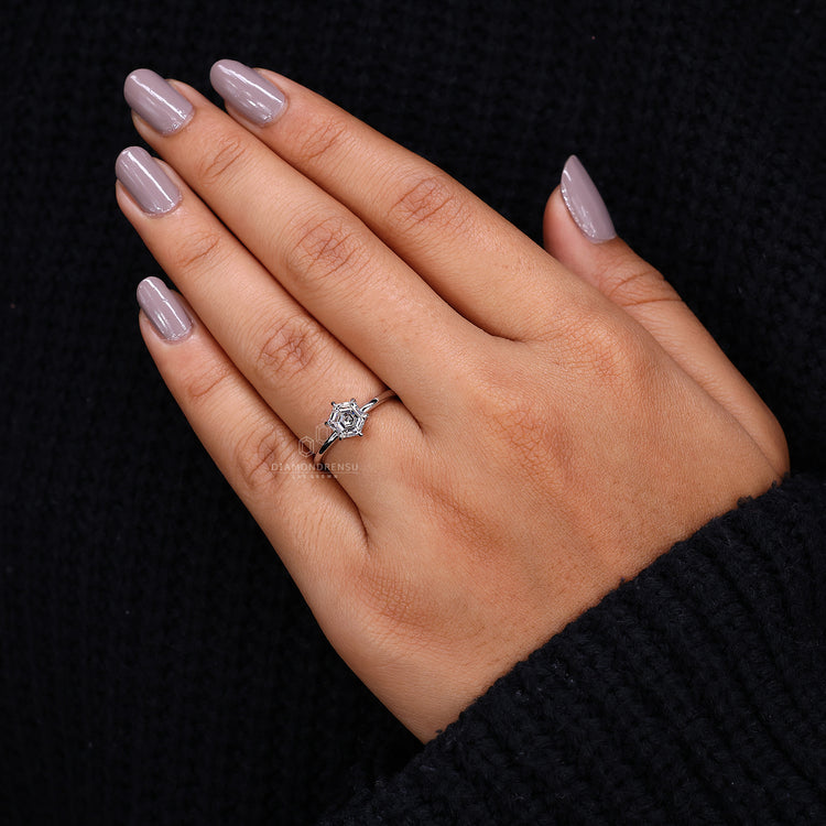 Hexagon step cut diamond ring is a simple engagement ring.
