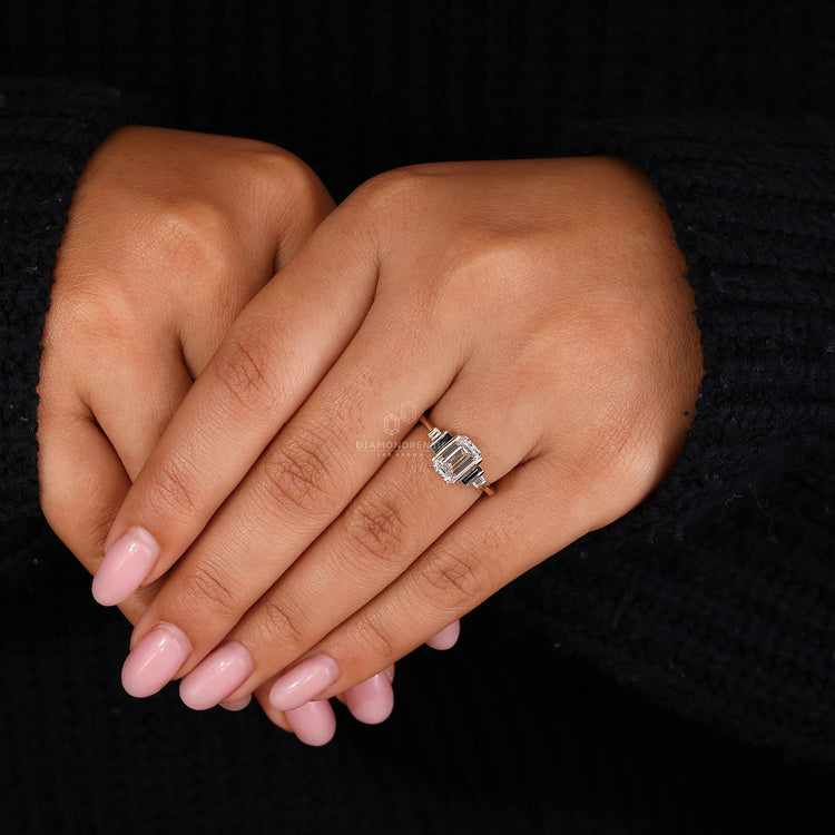 Baguette cut blue sapphire side stones in custom yellow gold ring.
