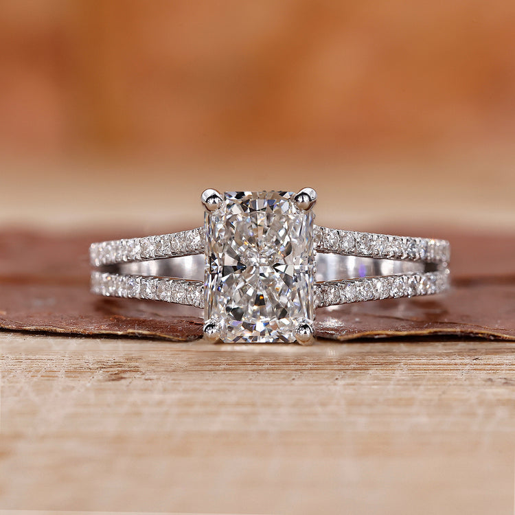Radiant cut diamond ring set in white gold engagement ring.
