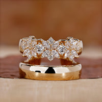 yellow gold diamond ring with prong setting detail.
