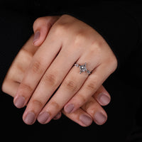 v prong setting on 3 stone diamond engagement ring.
