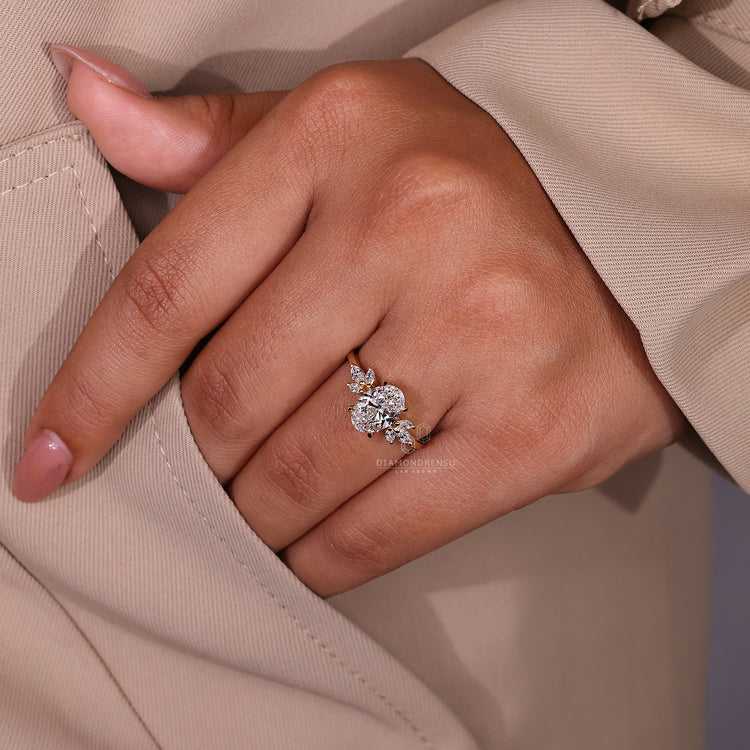 Oval and marquise cut diamond ring in a unique muse setting with hidden halo detail.
