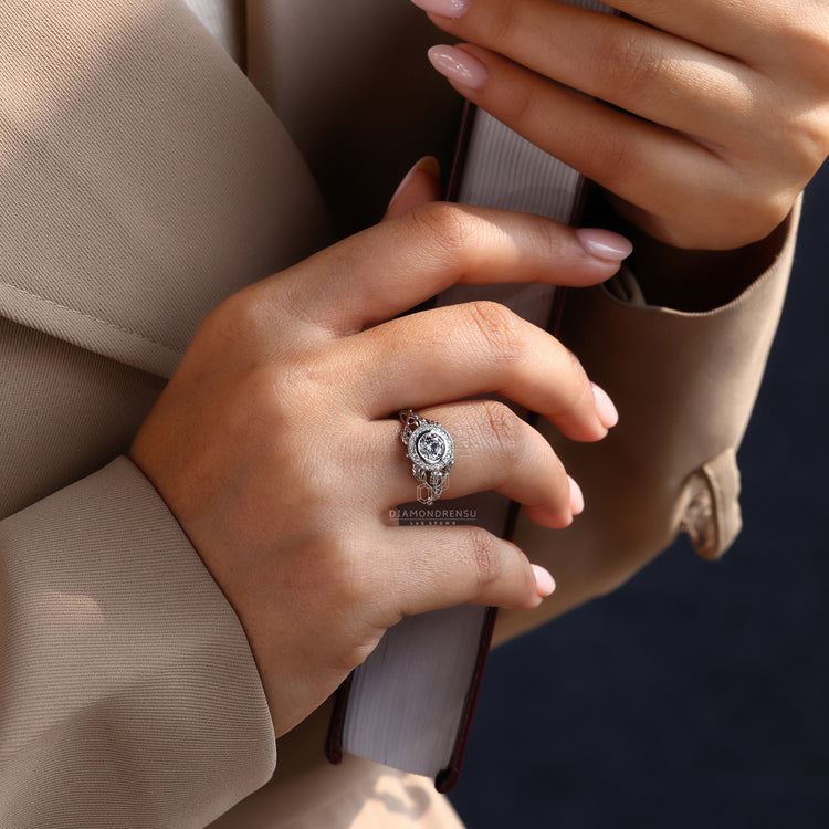 Nature inspired round diamond ring with halo design.
