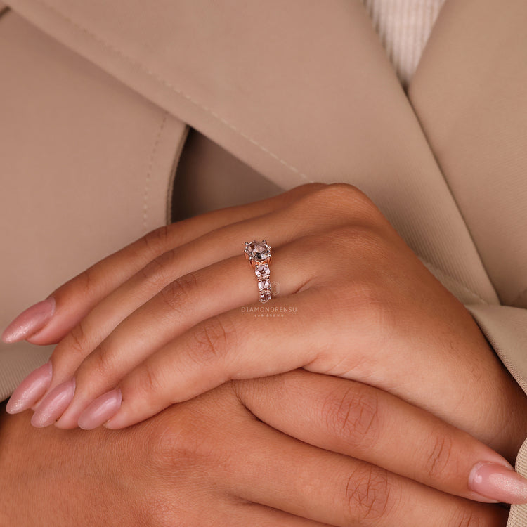 IGI certified rose gold ring with rose cut centre and side stones.
