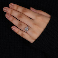 Round cut pave band in a cushion cut diamond ring.
