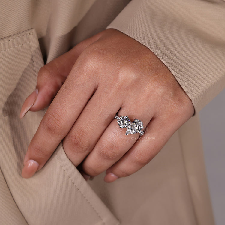Custom diamond ring with pavé details and Toi Et Moi setting.
