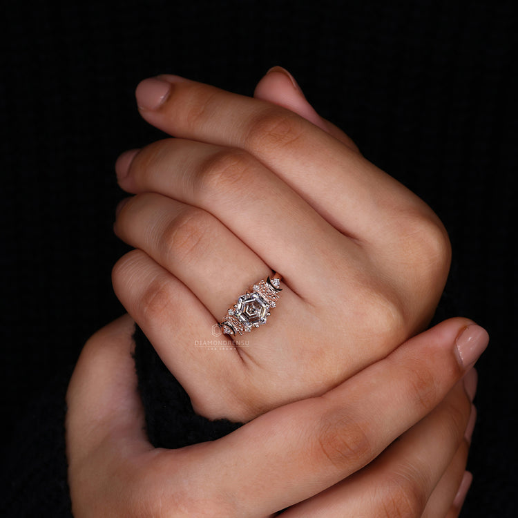 unique engagement ring with round diamond side stone.
