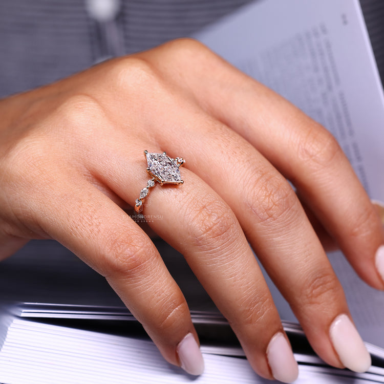 Seven Diamond Ring with Dutch marquise center and lab grown diamonds.
