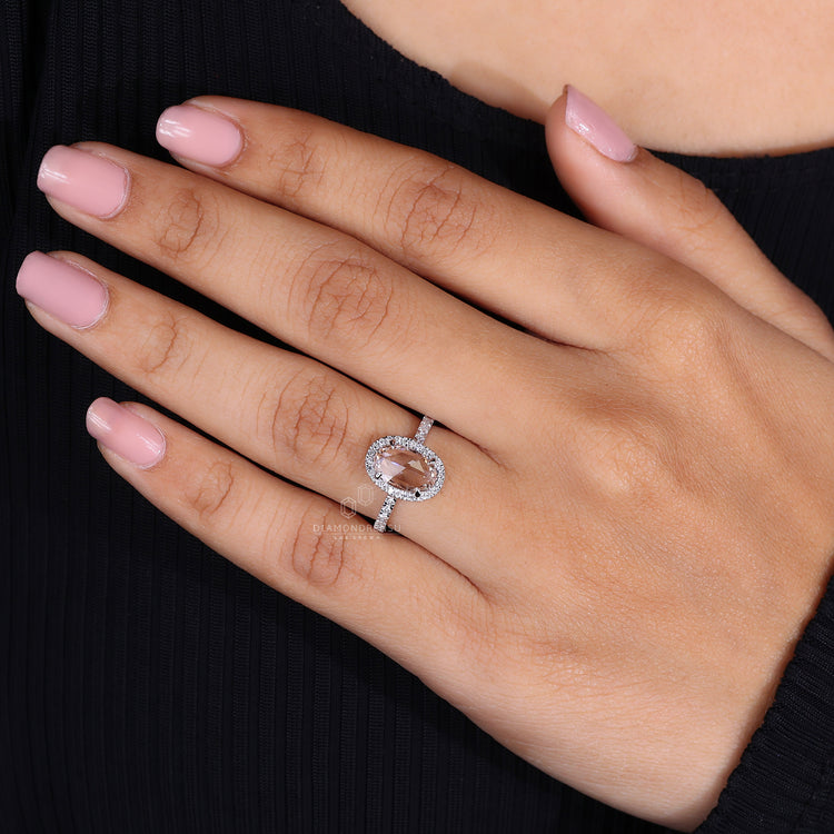 White gold diamond ring with round side diamond.
