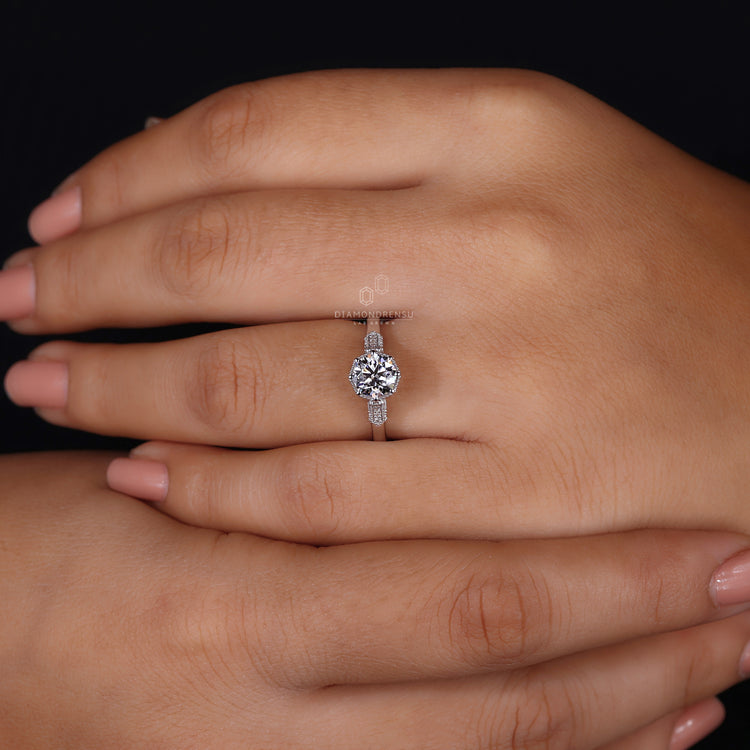 IGI certified ring with round cut side stones.
