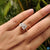 Emerald and pear cut ring in a unique and stunning design.