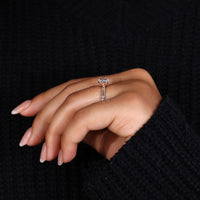 Pavé setting ring with round diamond and knife edge style.
