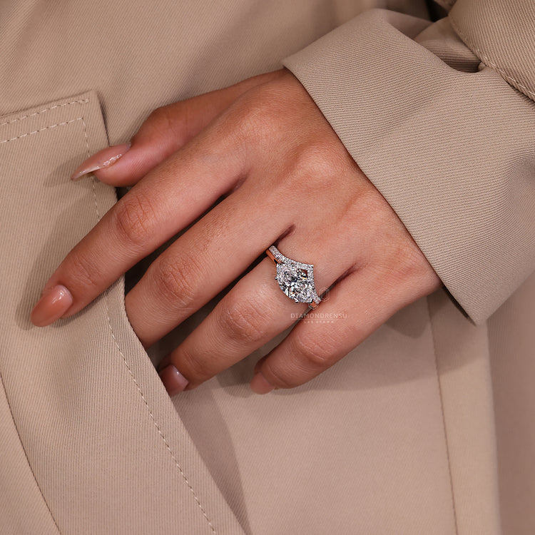 Marquise diamond ring with two tone white and rose gold design.

