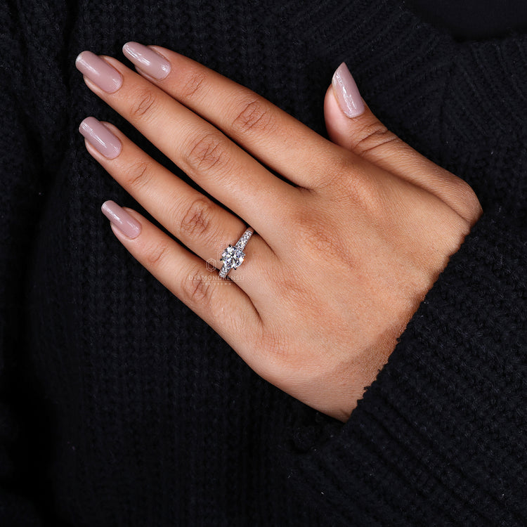 White gold engagement ring with 4 claw prong setting.
