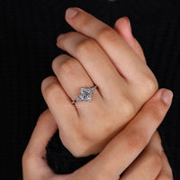 V prong setting on white gold engagement ring.
