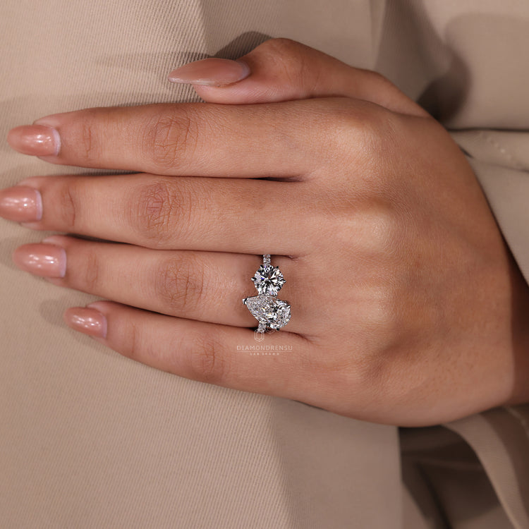 Lab grown diamond ring with pavé band and v prong setting.
